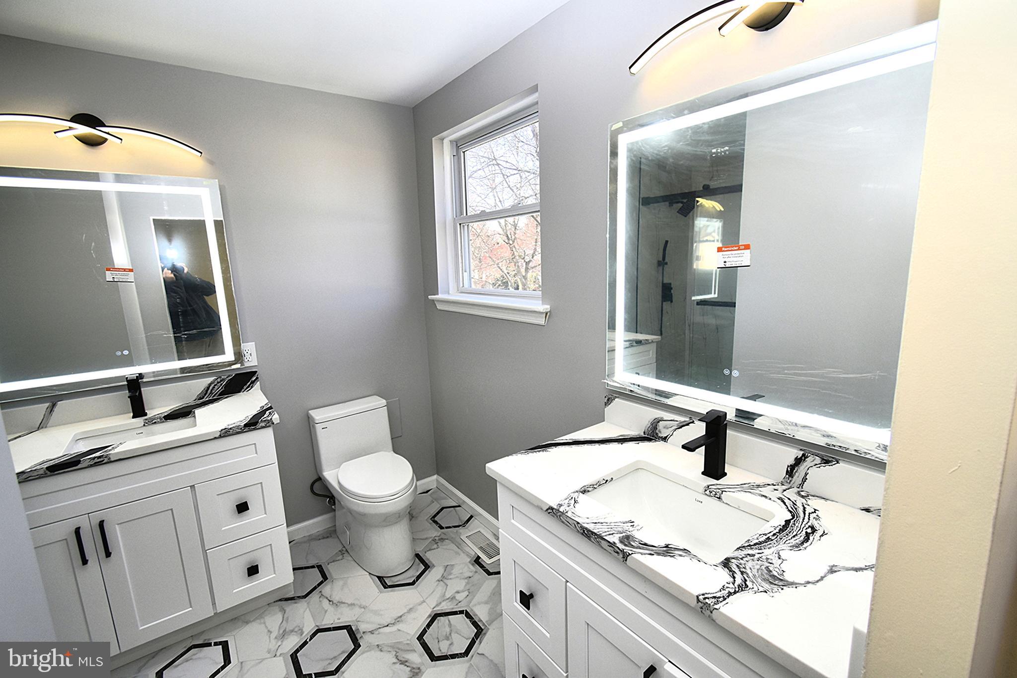 906 Marlowe Road Cherry Hill, NJ 08003 - Photo 24 of 38 a bathroom with a granite countertop sink mirror and toilet