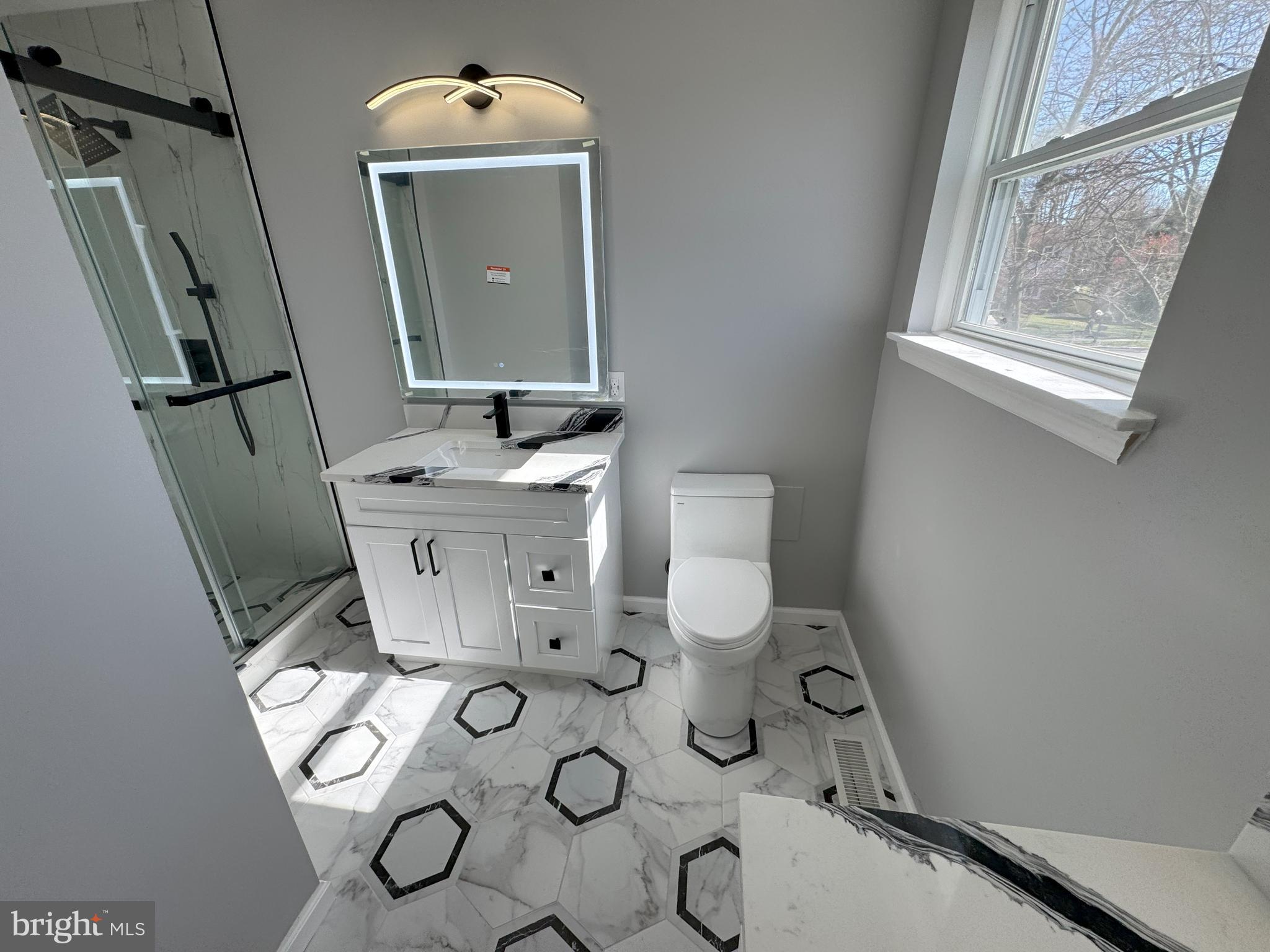 906 Marlowe Road Cherry Hill, NJ 08003 - Photo 26 of 38 a bathroom with a sink mirror vanity and toilet
