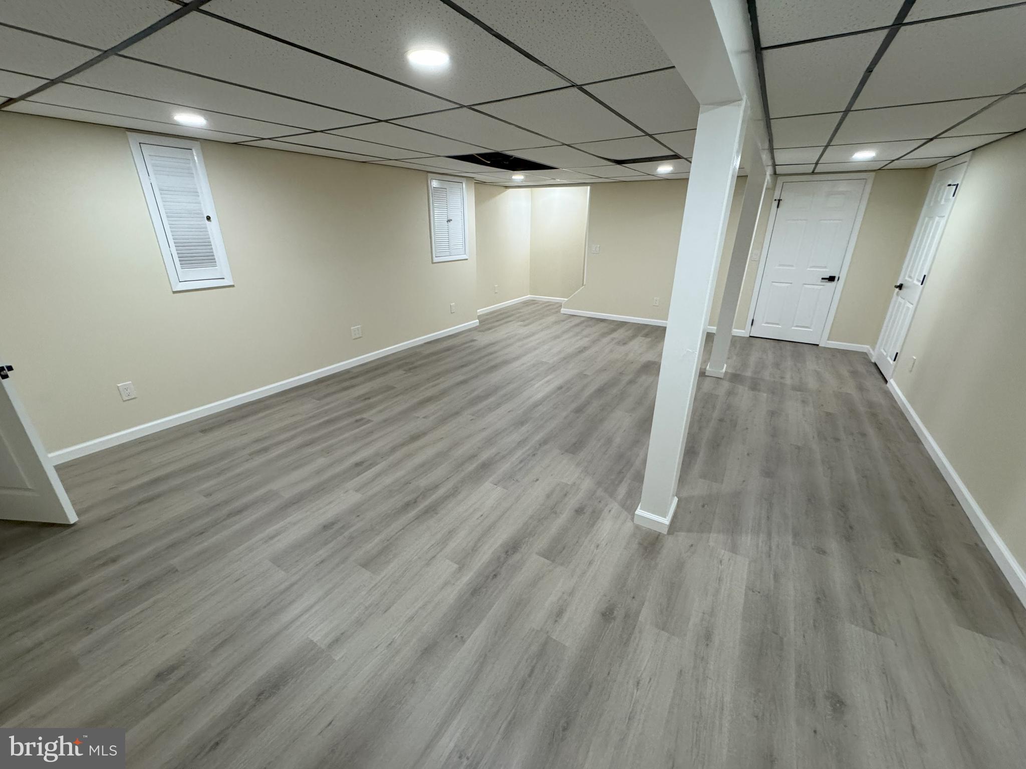 906 Marlowe Road Cherry Hill, NJ 08003 - Photo 30 of 38 an empty room with wooden floor and windows