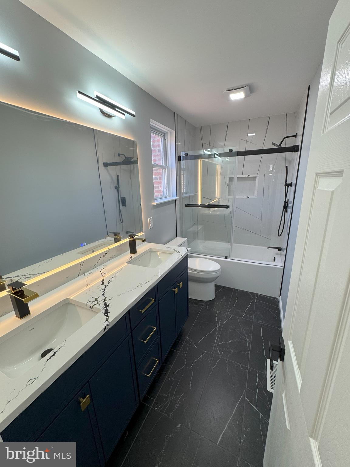 906 Marlowe Road Cherry Hill, NJ 08003 - Photo 31 of 38 a bathroom with a double vanity sink and mirror
