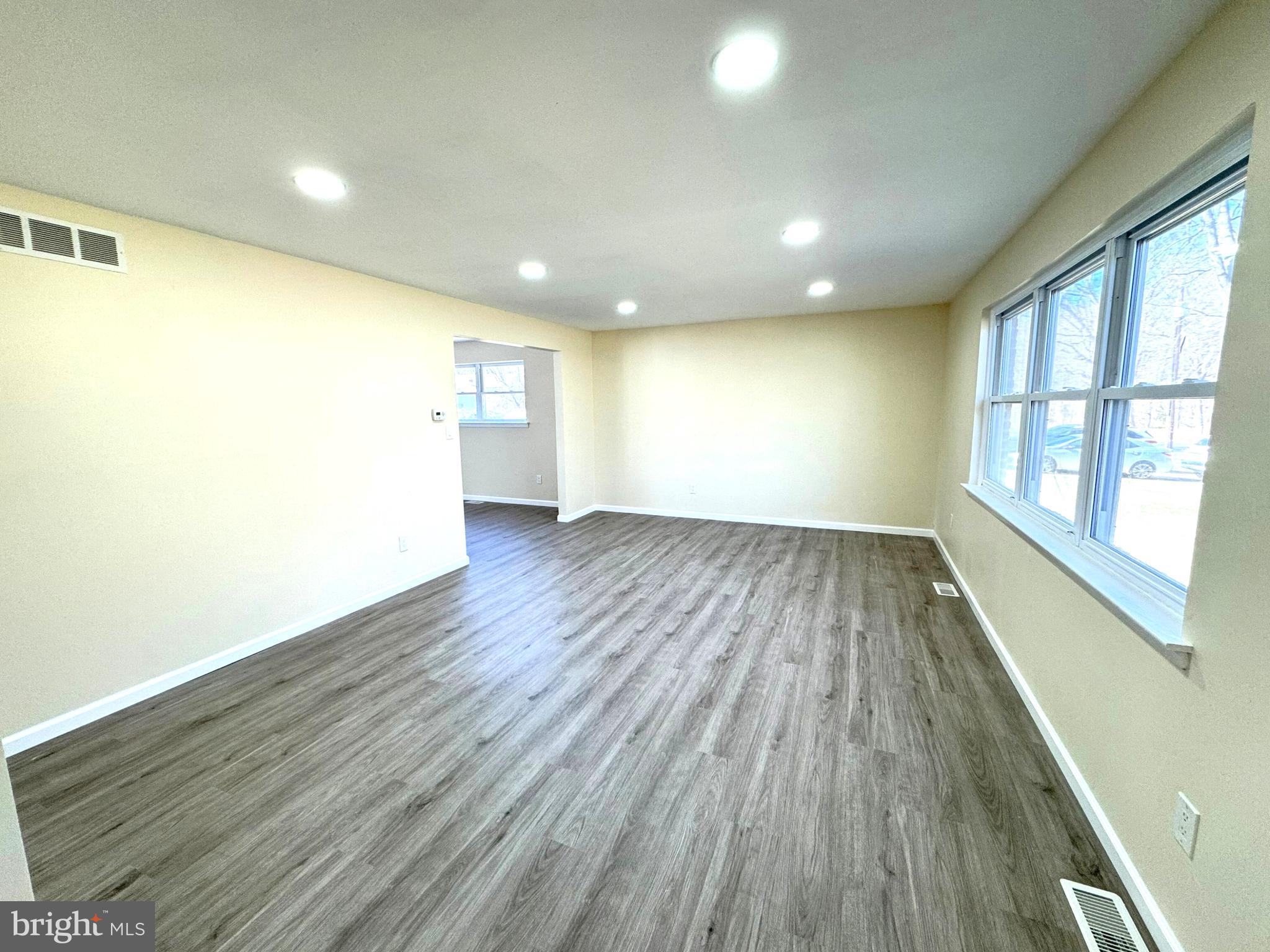 906 Marlowe Road Cherry Hill, NJ 08003 - Photo 6 of 38 wooden floor in an empty room with a window