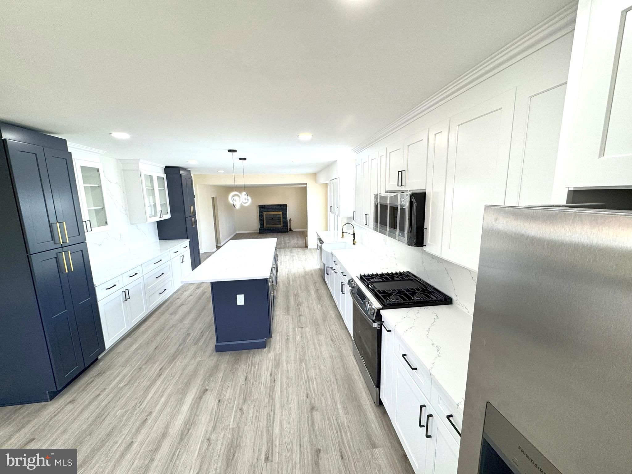 906 Marlowe Road Cherry Hill, NJ 08003 - Photo 10 of 38 a kitchen with stainless steel appliances a refrigerator a sink a stove top oven a counter space and cabinets