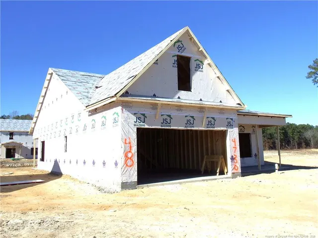 a front view of a house with a outdoor space