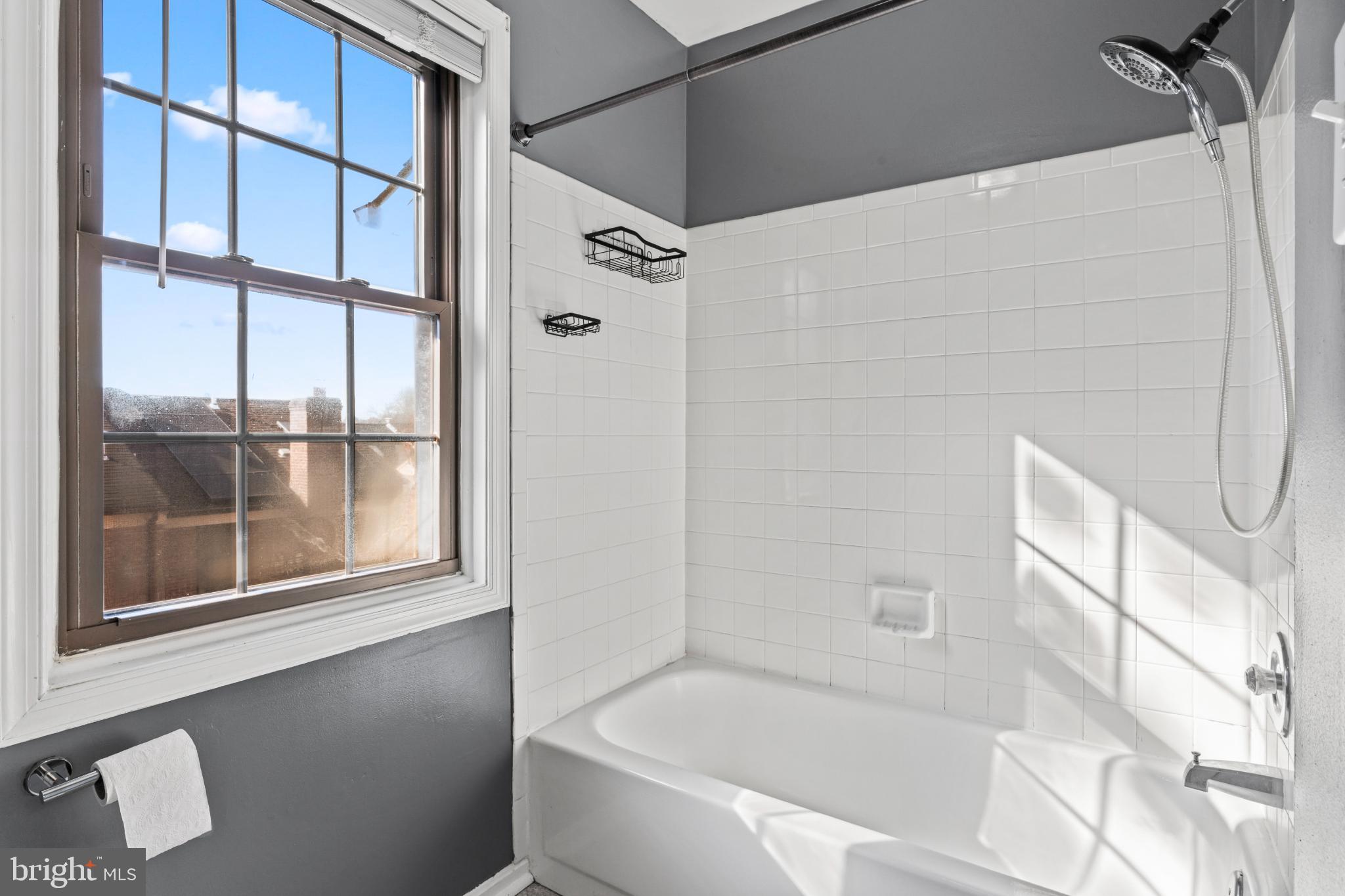 5416 Wycklow Court Alexandria, VA 22304 - Photo 19 of 46 a bathroom with a tub and shower