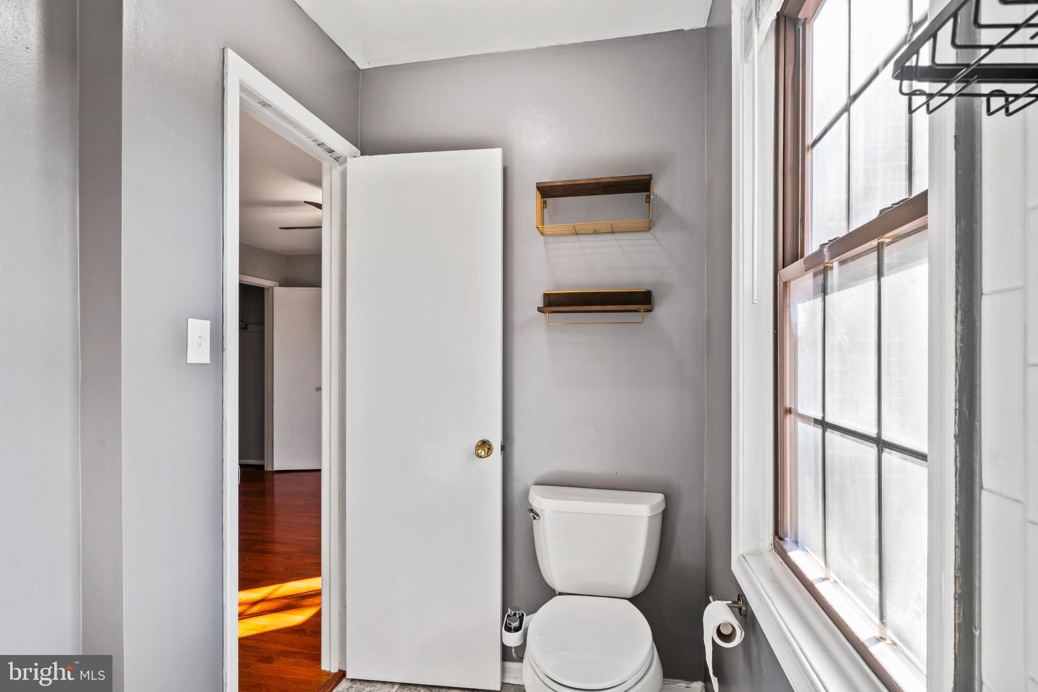 5416 Wycklow Court Alexandria, VA 22304 - Photo 21 of 46 a bathroom with a toilet and a shower