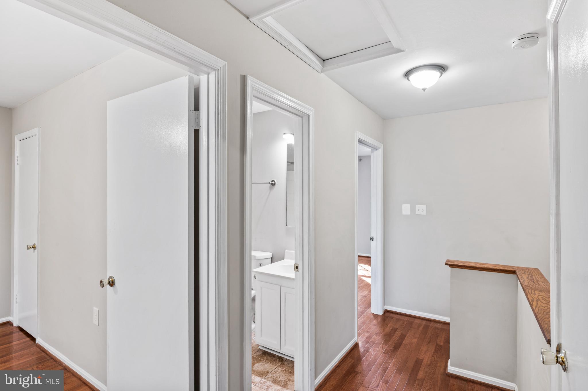5416 Wycklow Court Alexandria, VA 22304 - Photo 22 of 46 a view of a hallway with wooden floor