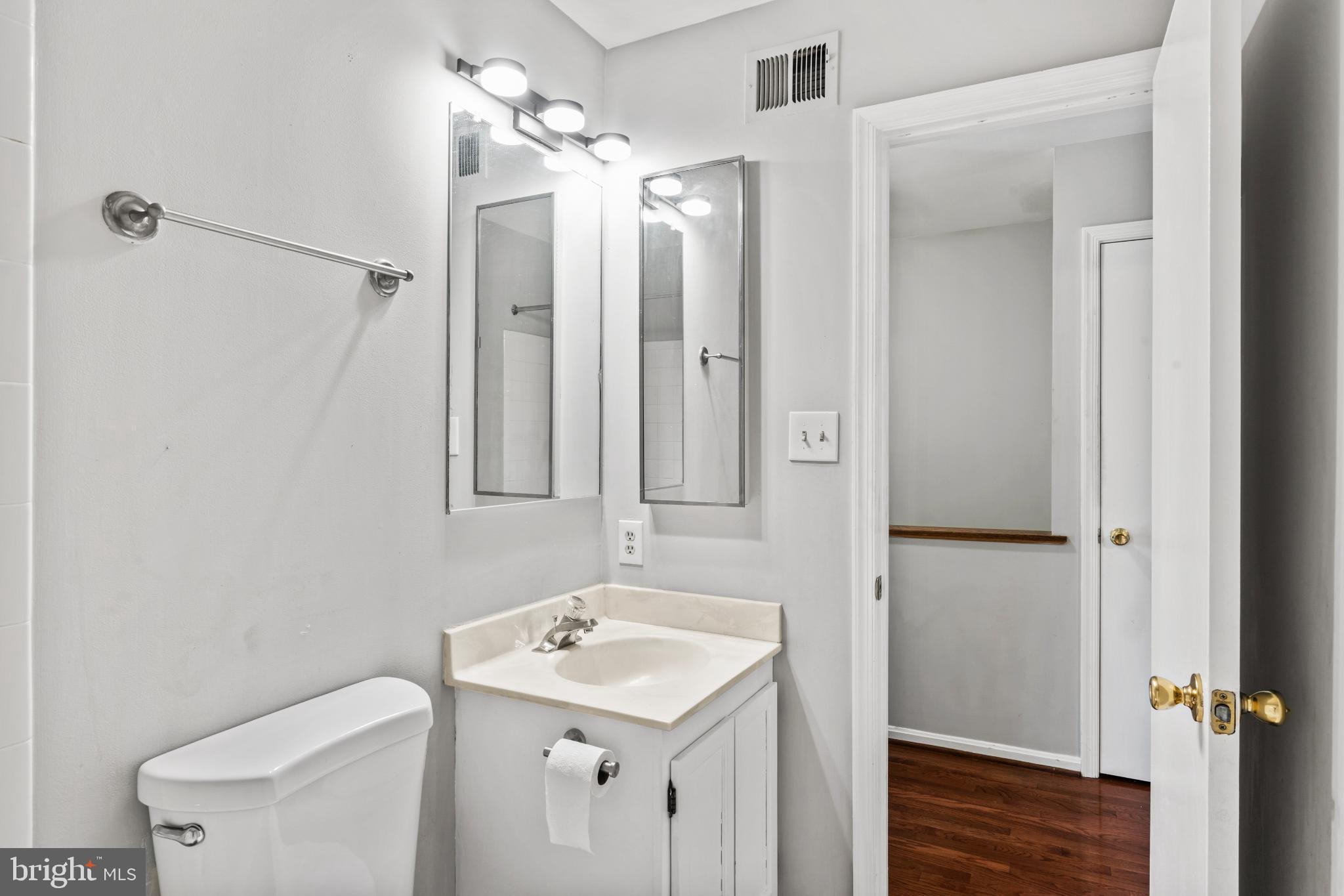 5416 Wycklow Court Alexandria, VA 22304 - Photo 26 of 46 a bathroom with a sink a toilet and shower