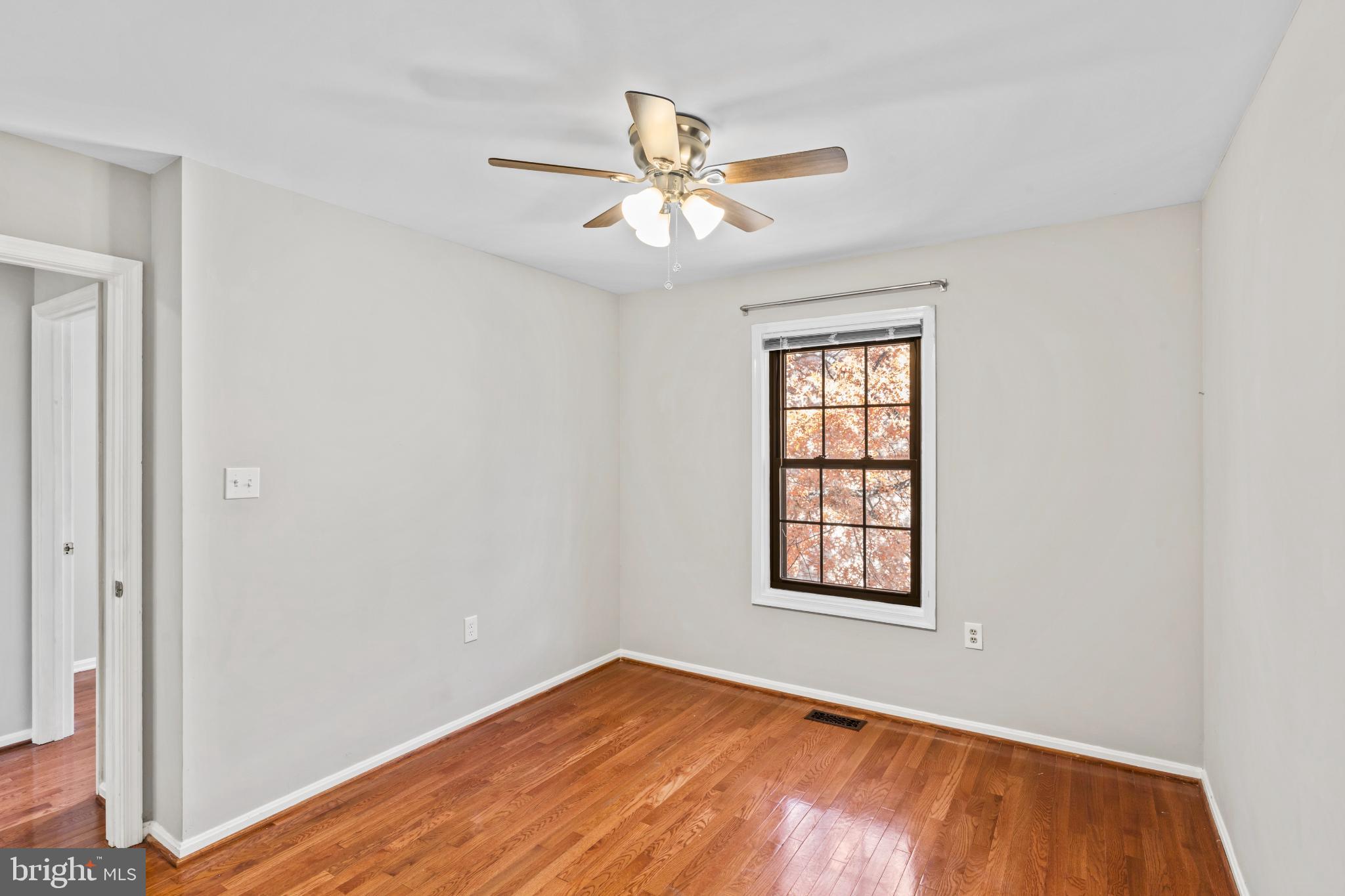 5416 Wycklow Court Alexandria, VA 22304 - Photo 28 of 46 an empty room with windows and fan
