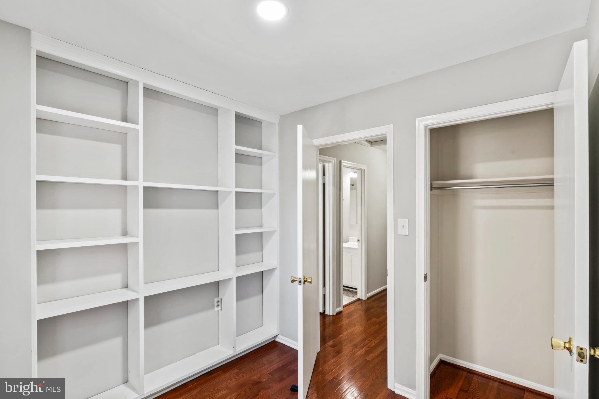 5416 Wycklow Court Alexandria, VA 22304 - Photo 29 of 46 a view of walk in closet with empty racks