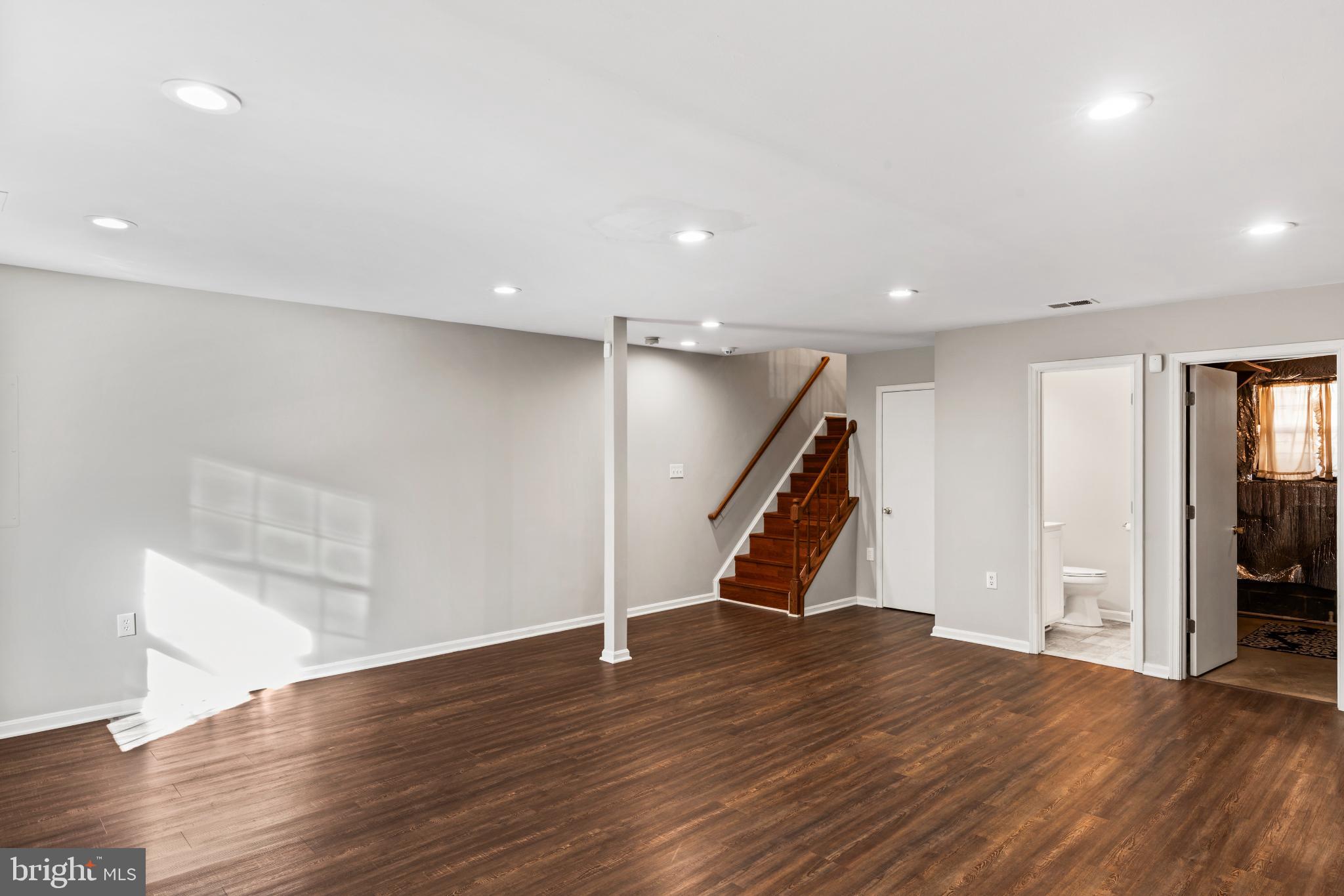 5416 Wycklow Court Alexandria, VA 22304 - Photo 32 of 46 an empty room with wooden floor and entryway
