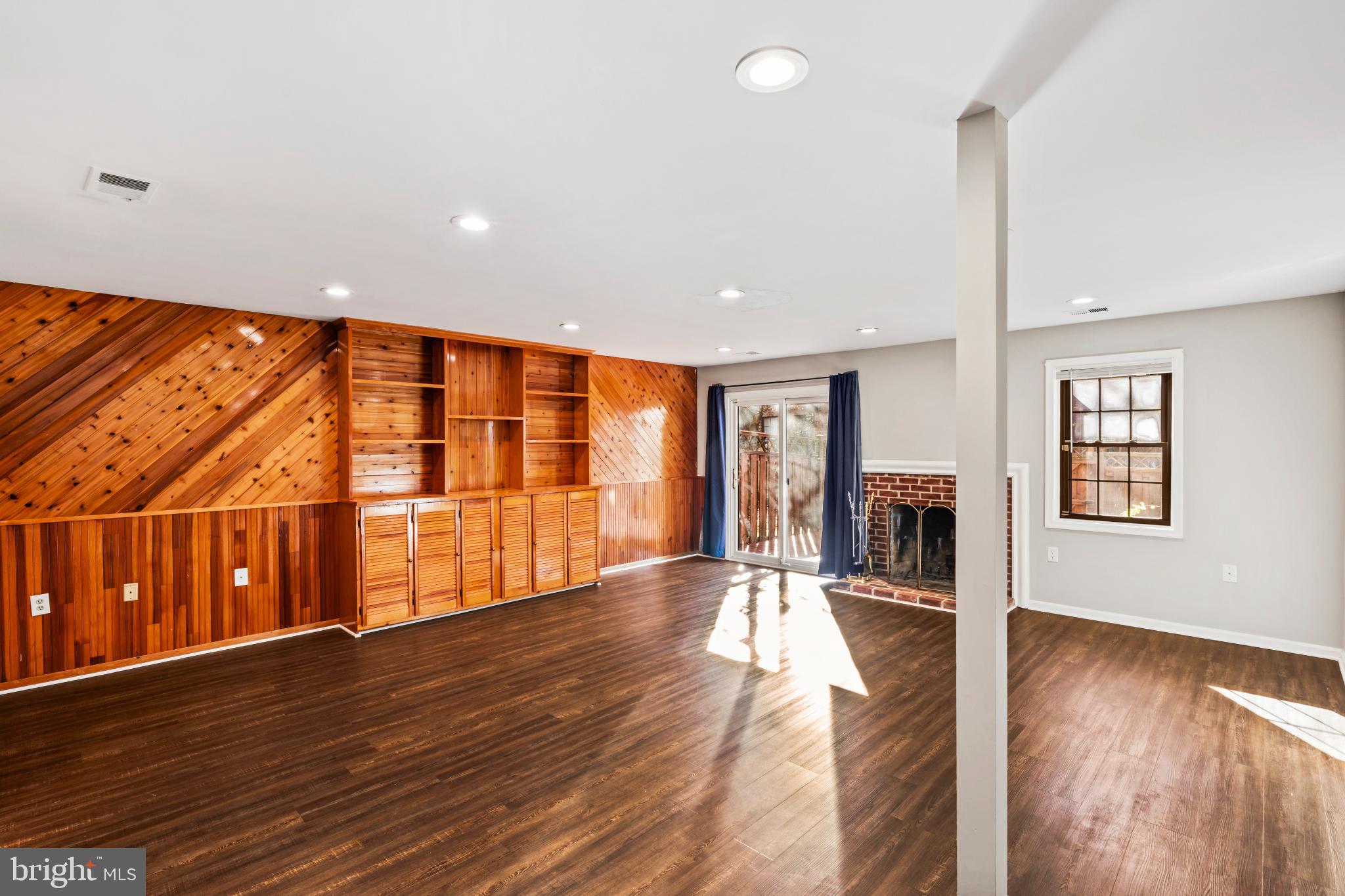 5416 Wycklow Court Alexandria, VA 22304 - Photo 34 of 46 a view of an empty room with wooden floor and a window