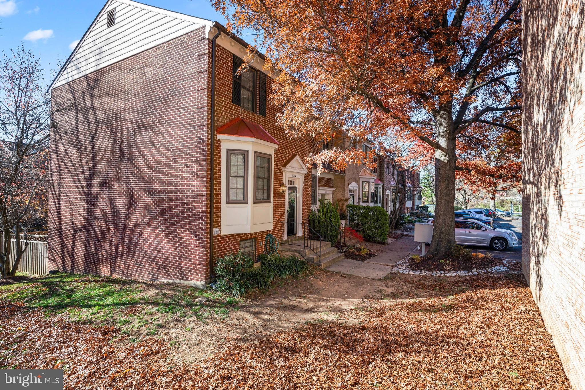 5416 Wycklow Court Alexandria, VA 22304 - Photo 39 of 46 a view of a house with a yard covered in the forest