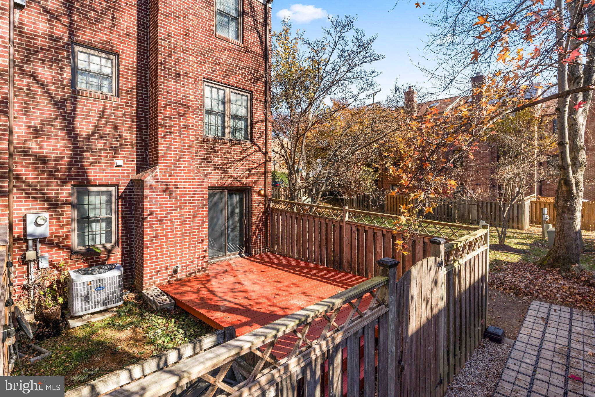 5416 Wycklow Court Alexandria, VA 22304 - Photo 41 of 46 a view of balcony with wooden fence and trees