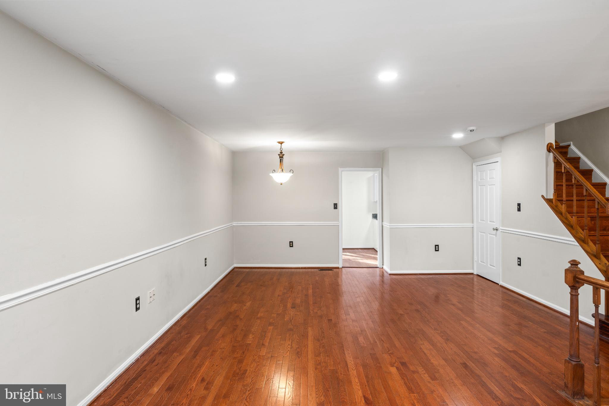 5416 Wycklow Court Alexandria, VA 22304 - Photo 7 of 46 an empty room with wooden floor and windows
