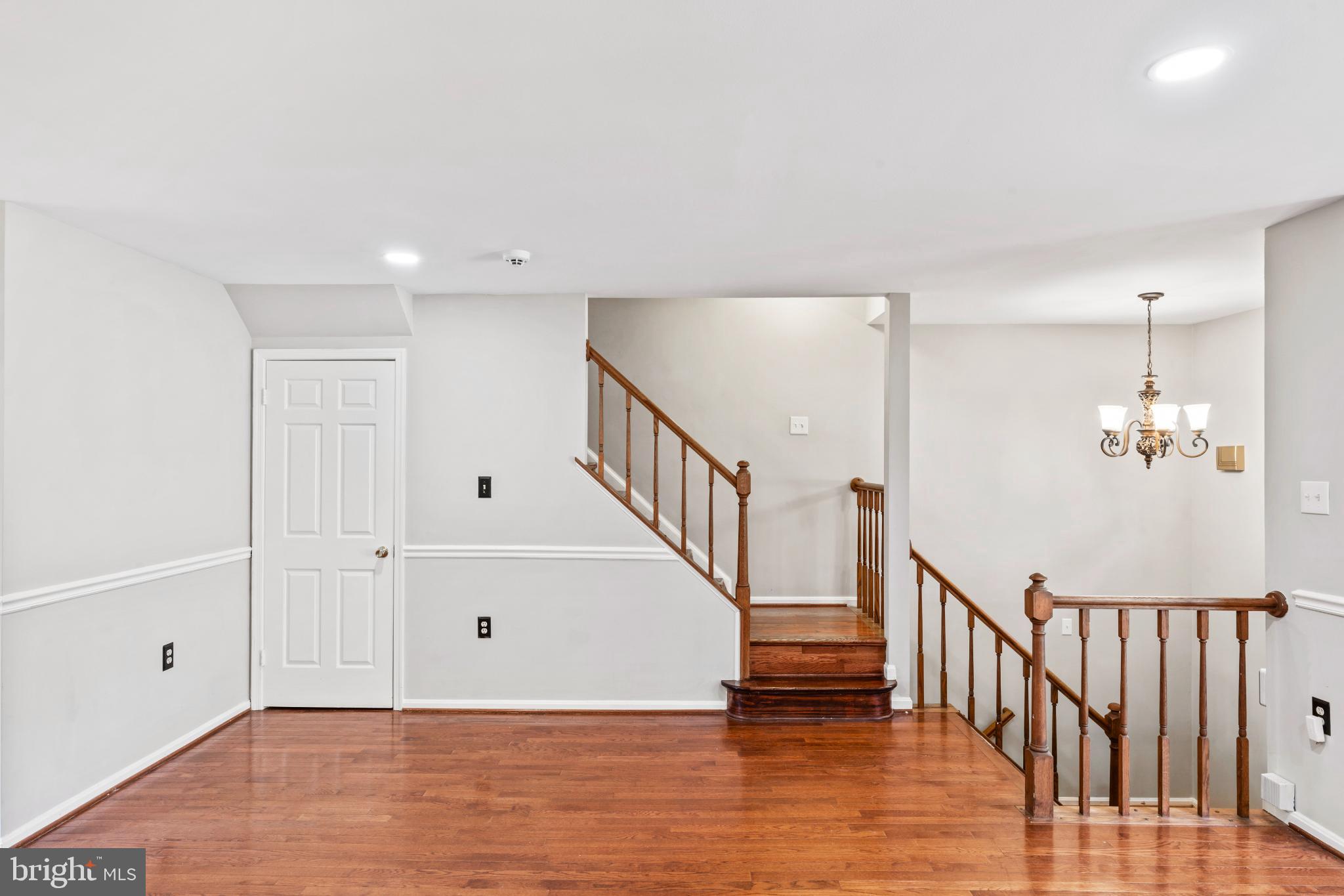 5416 Wycklow Court Alexandria, VA 22304 - Photo 8 of 46 a view of a hallway with wooden floor and staircase