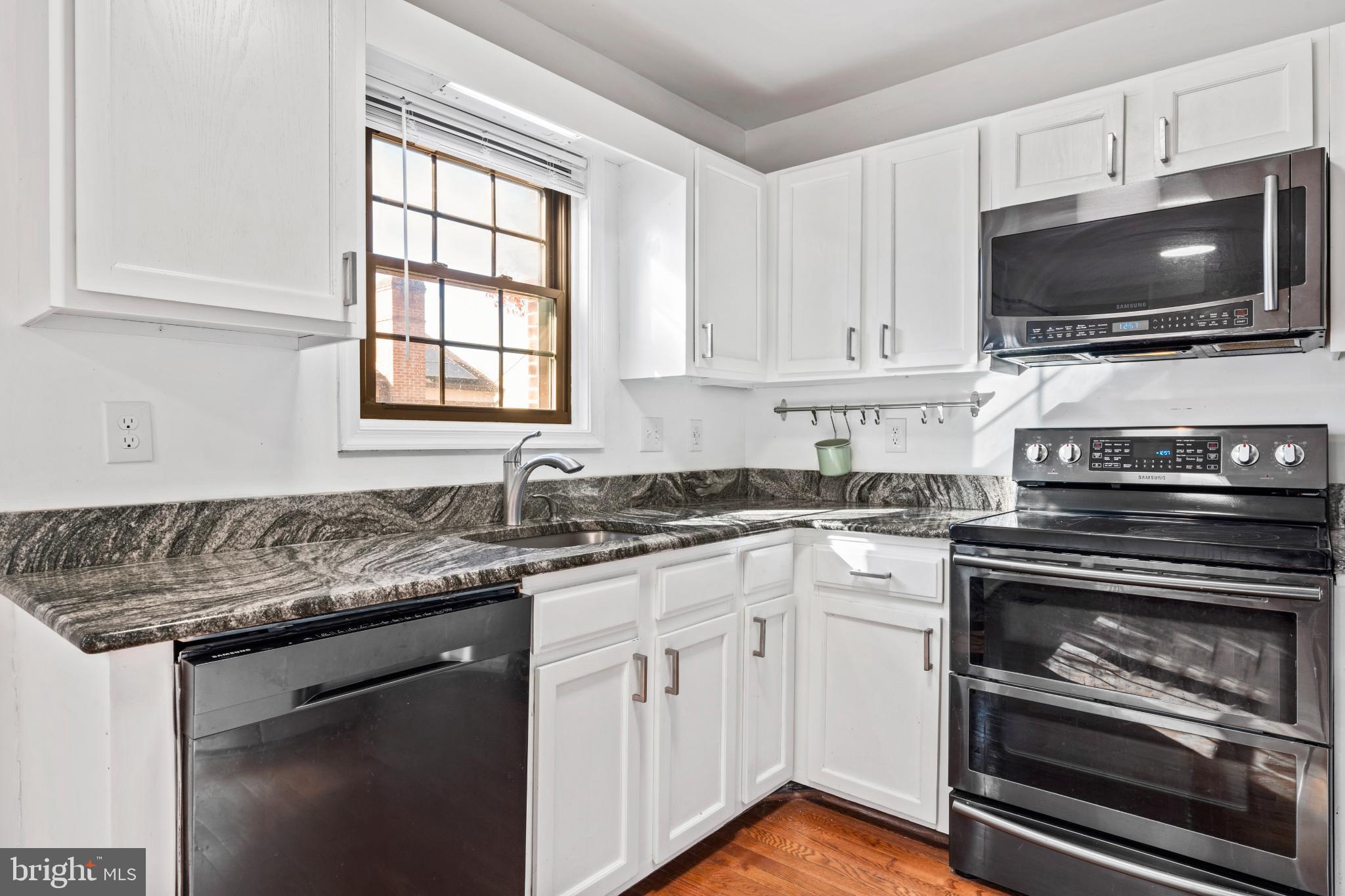 5416 Wycklow Court Alexandria, VA 22304 - Photo 10 of 46 a kitchen with appliances a sink and a stove