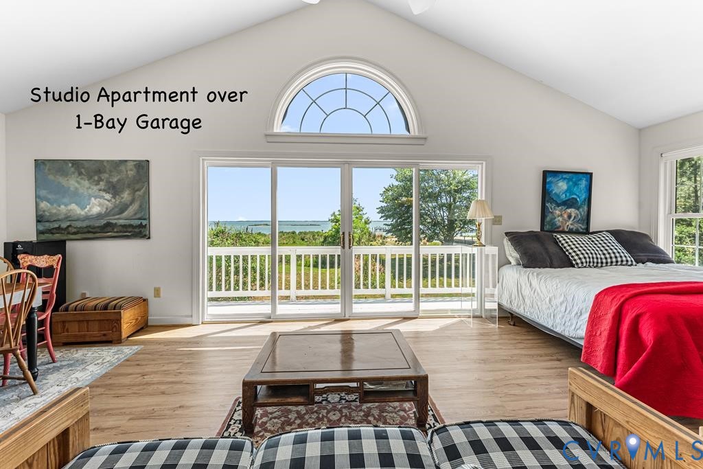 2414 Windmill Point Road White Stone, VA 22578 - Photo 53 of 72 a bedroom with furniture and a large window