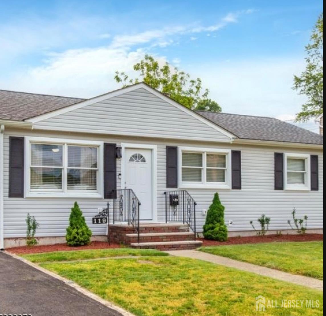 front view of a house that has a yard