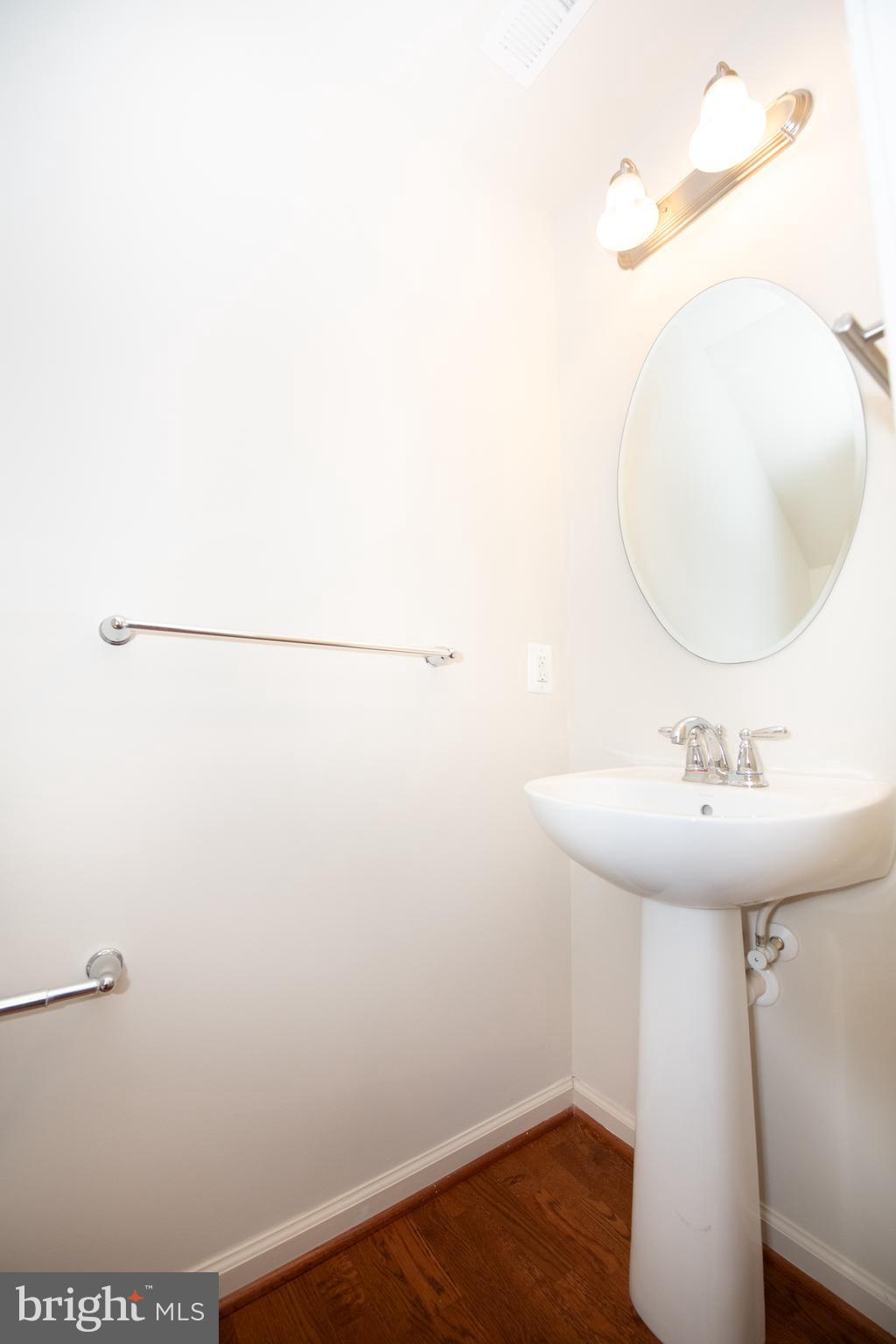 306 Mill Pond Road, Unit A Frederick, MD 21701 - Photo 13 of 31 Half bathroom off kitchen