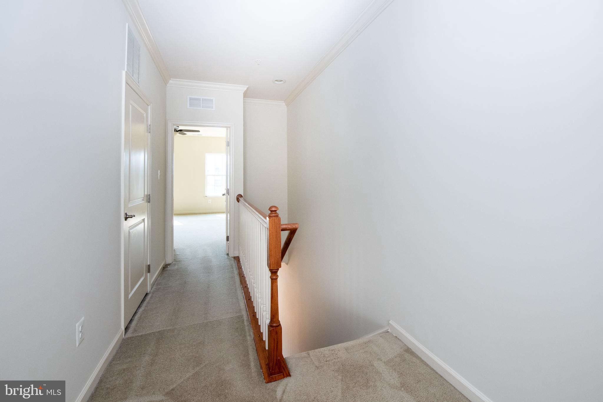 306 Mill Pond Road, Unit A Frederick, MD 21701 - Photo 17 of 31 Upstairs landing and hallway