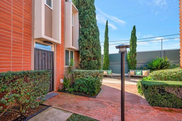 a kitchen with stainless steel appliances a refrigerator sink and stove