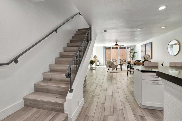 a view of a patio with table and chairs with wooden floor