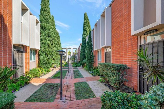 a view of a entryway with wooden floor and a fireplace
