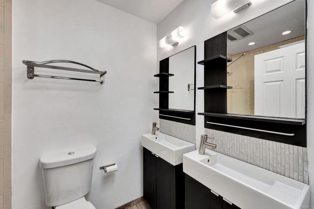 a bathroom with a shower and a toilet