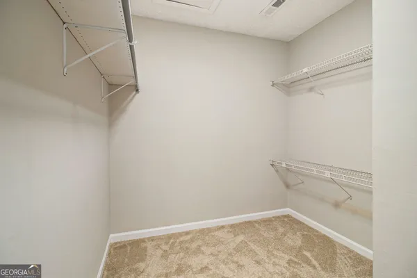 a view of a room with racks on the wall