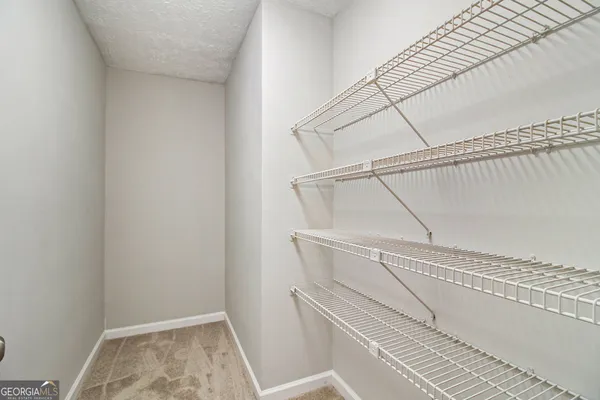 a view of staircase with white walls