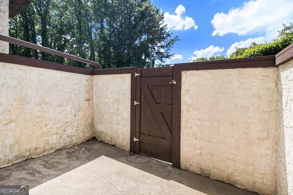 a view of a door in the backyard of a house
