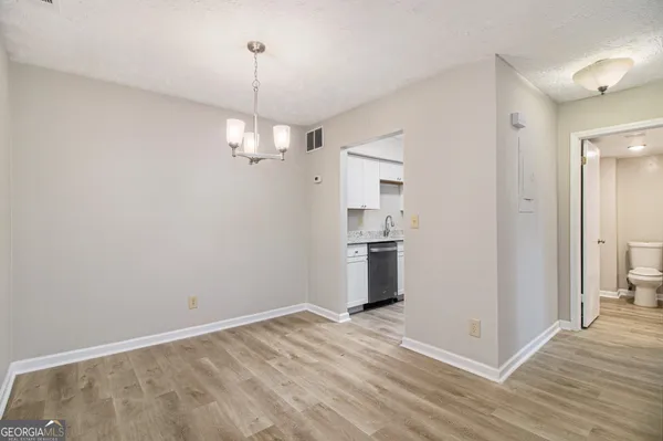 a view of a kitchen with a sink and dishwasher