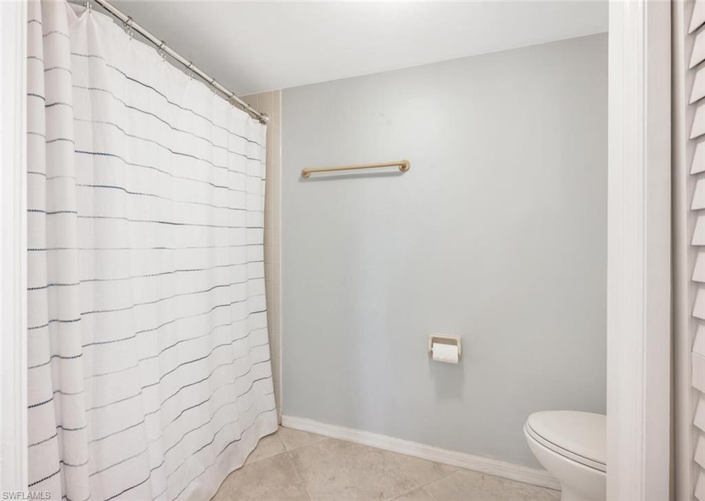 7300 St Ives Way, Unit 5208 Naples, FL 34104 - Photo 21 of 37 a bathroom with a shower