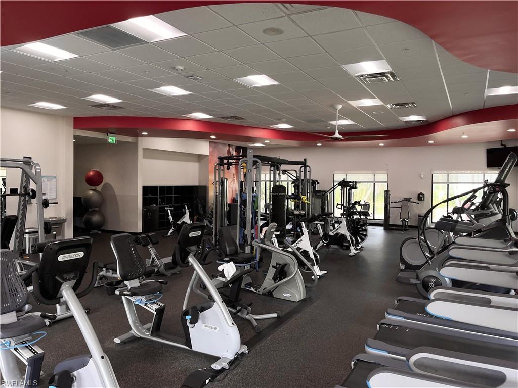 7300 St Ives Way, Unit 5208 Naples, FL 34104 - Photo 31 of 37 a view of a room with gym equipment
