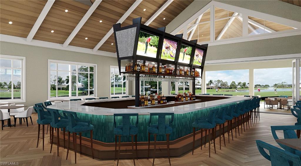 7300 St Ives Way, Unit 5208 Naples, FL 34104 - Photo 32 of 37 a view of a dining room with furniture large windows and wooden floor