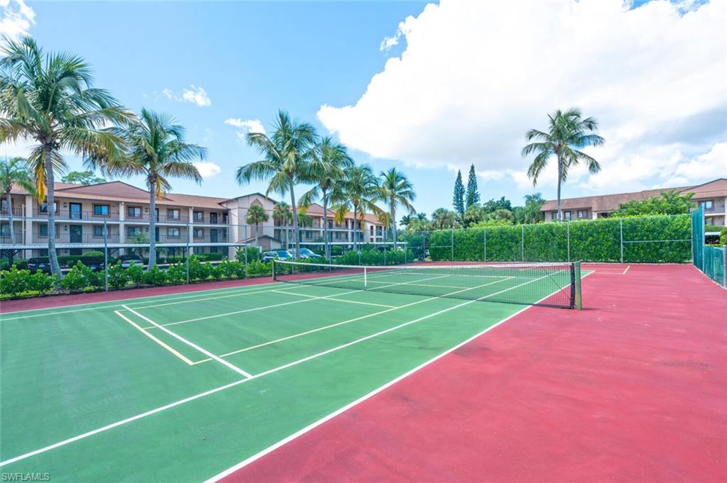 7300 St Ives Way, Unit 5208 Naples, FL 34104 - Photo 36 of 37 a view of a tennis court