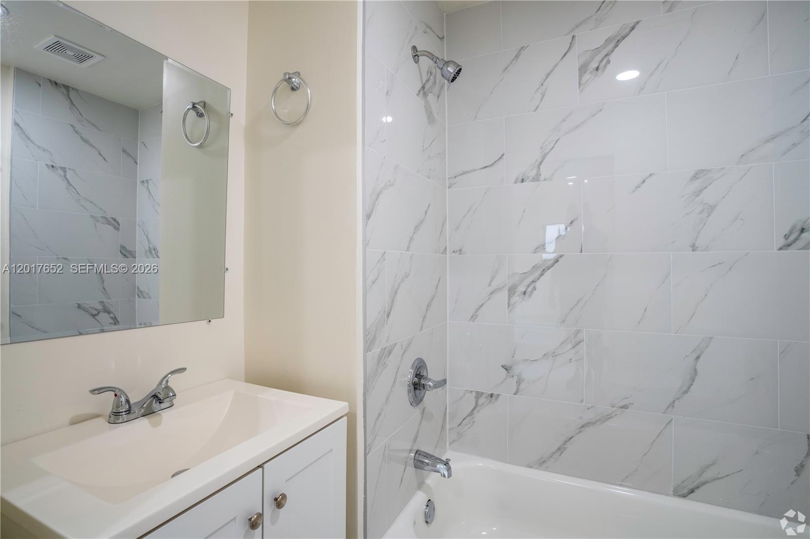 433 Southwest 6th Street, Unit 15 Miami, FL 33130 - Photo 11 of 12 a bathroom with a sink shower and a bathtub