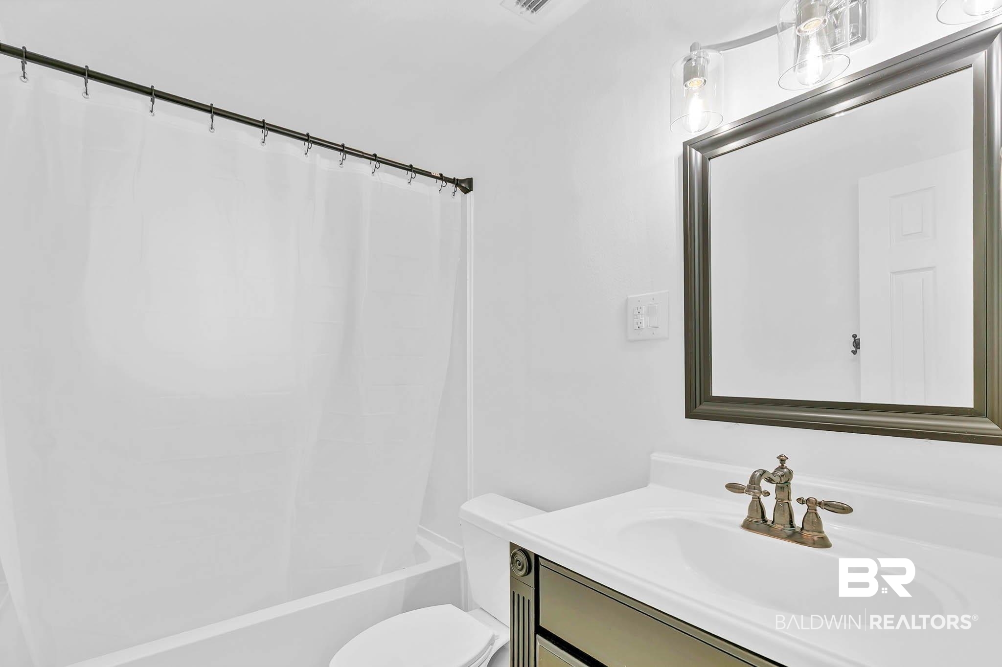 4705 Sherry Court Mobile, AL 36693 - Photo 52 of 100 Bathroom featuring vanity and shower / bath combination with curtain