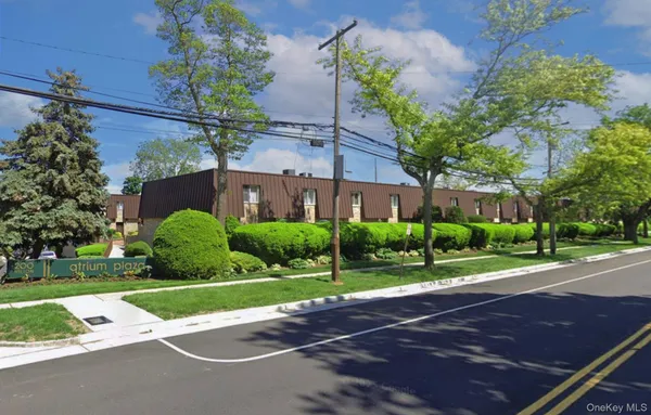 a view of a building with a yard