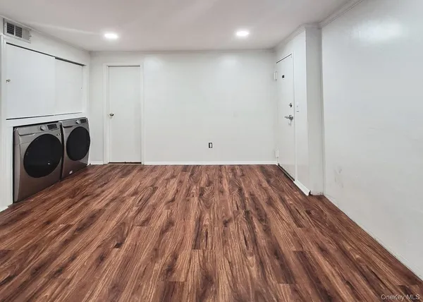 a view of a storage & utility room with washer and dryer
