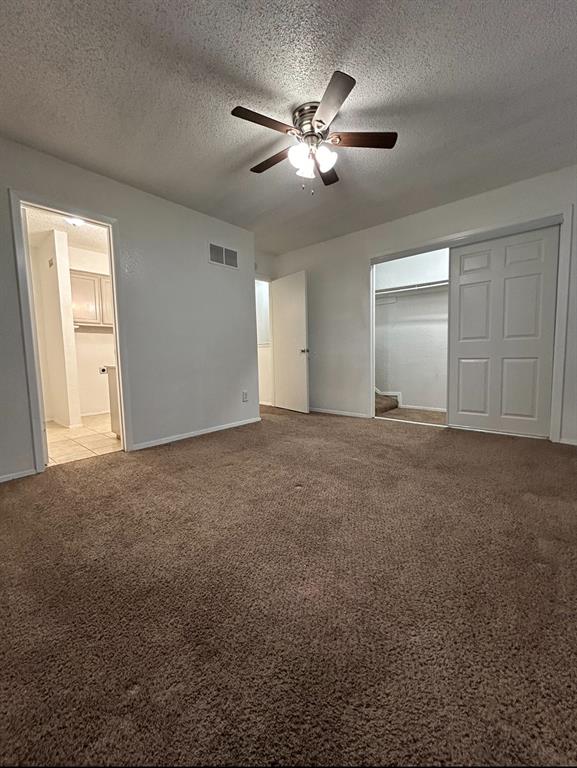 3006 West Sycamore Circle Euless, TX 76040 - Photo 11 of 16 a view of an empty room with a ceiling fan