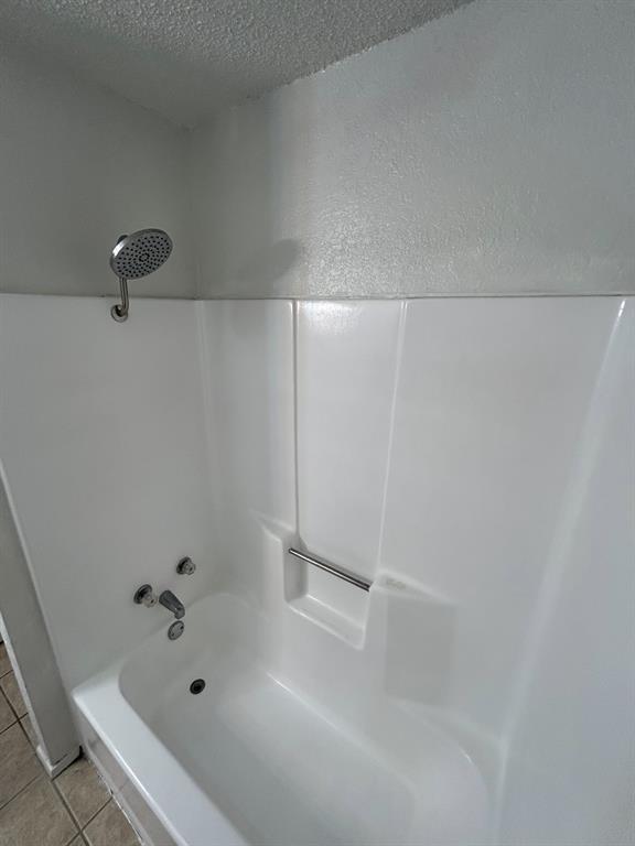 3006 West Sycamore Circle Euless, TX 76040 - Photo 14 of 16 a bathroom with a bathtub