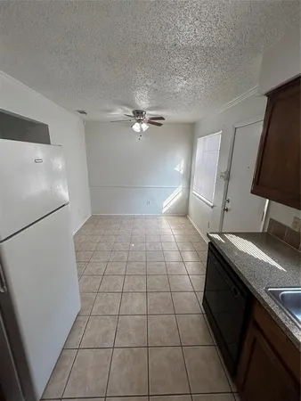a view of an empty room with a stove