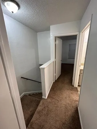 view of a hallway with stairs