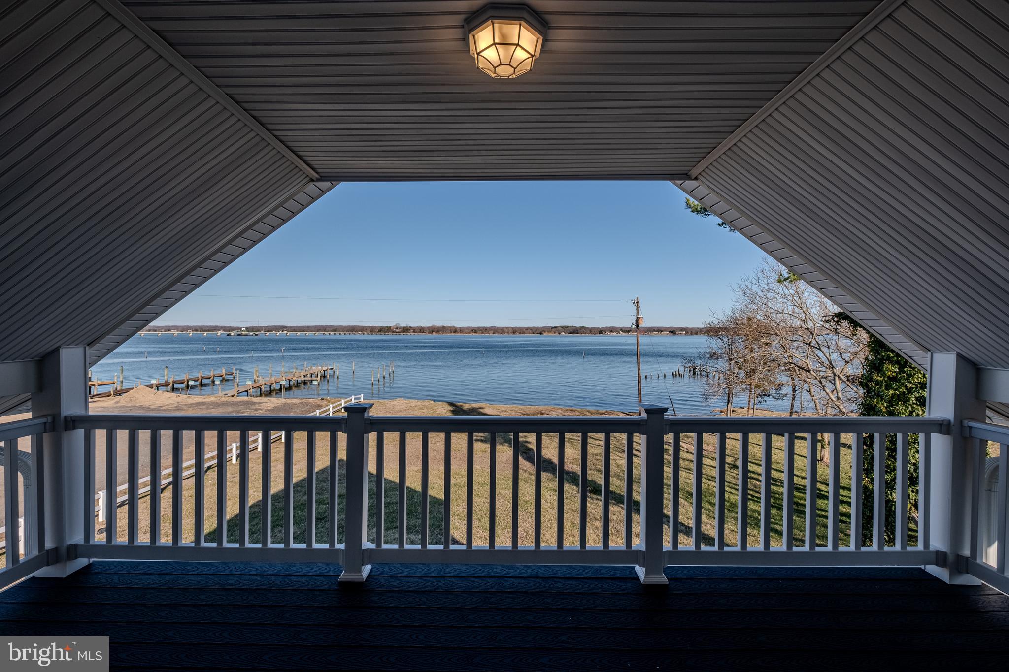 7391 Benedict Avenue Benedict, MD 20612 - Photo 26 of 38 a view of balcony with wooden floor