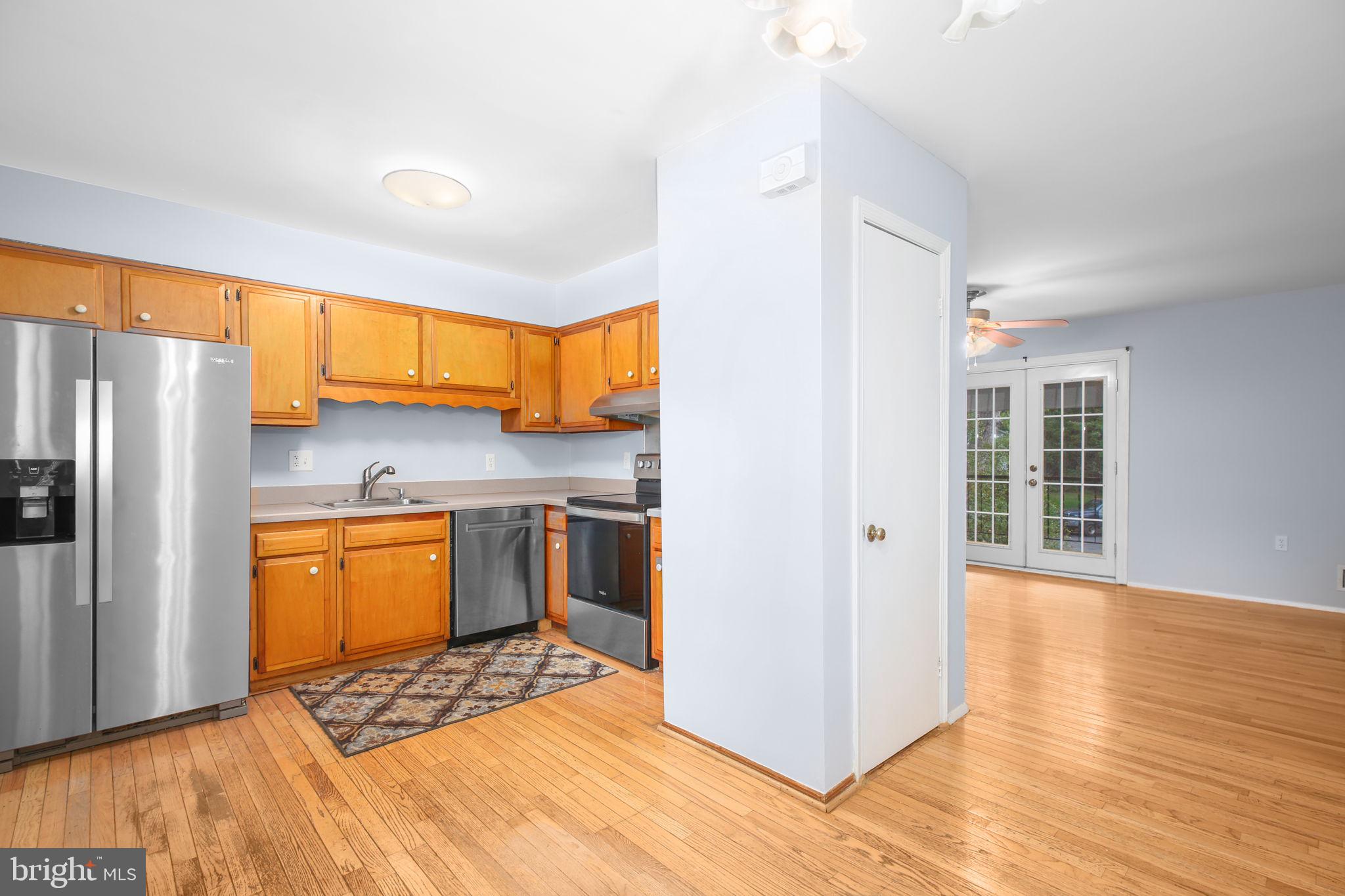 19007 Red Oak Lane Triangle, VA 22172 - Photo 11 of 34 a kitchen with stainless steel appliances granite countertop a refrigerator and a stove top oven
