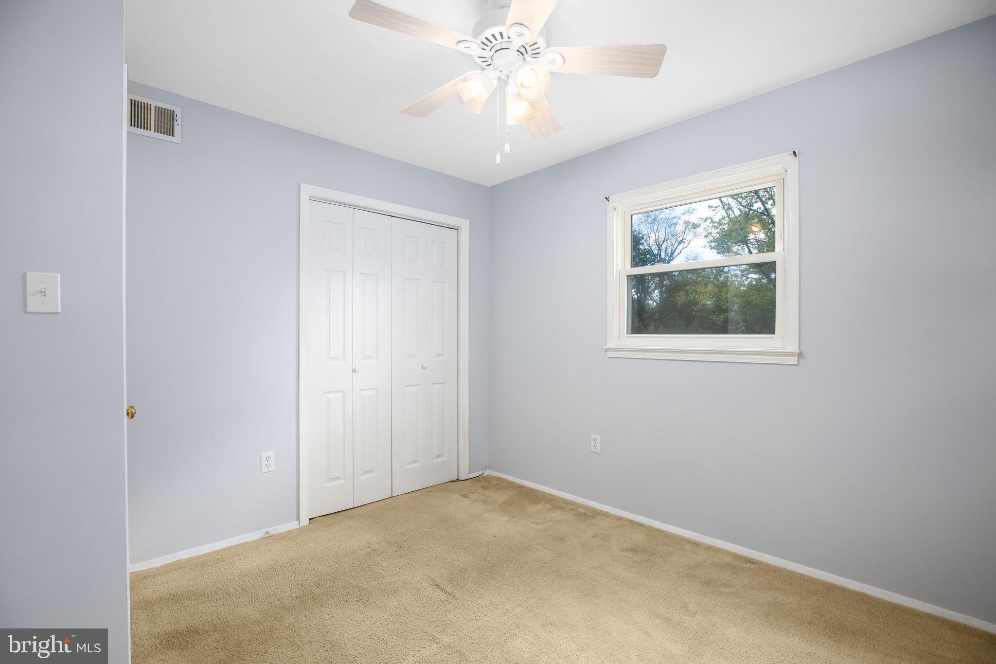 19007 Red Oak Lane Triangle, VA 22172 - Photo 15 of 34 an empty room with a window and a fan