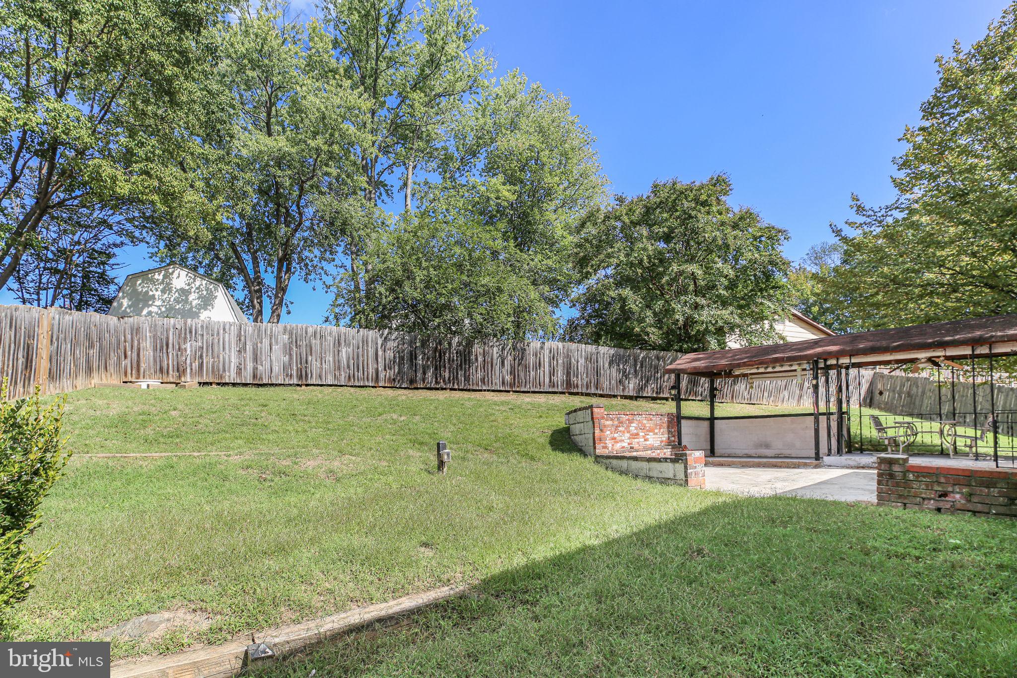 19007 Red Oak Lane Triangle, VA 22172 - Photo 27 of 34 a view of a backyard with a tree