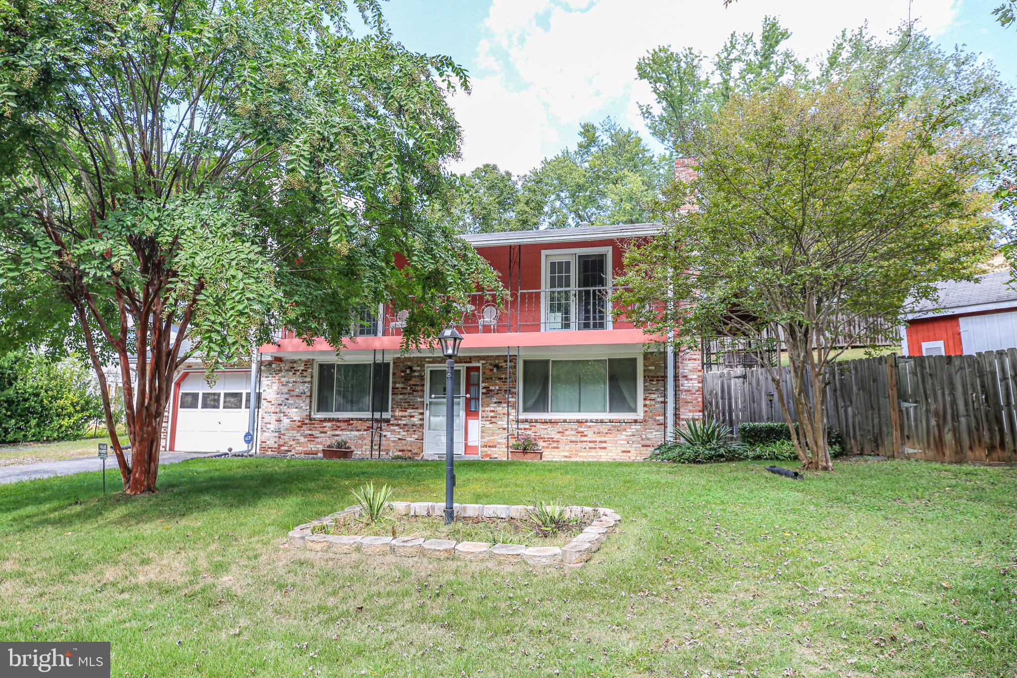 19007 Red Oak Lane Triangle, VA 22172 - Photo 34 of 34 a front view of a house with garden
