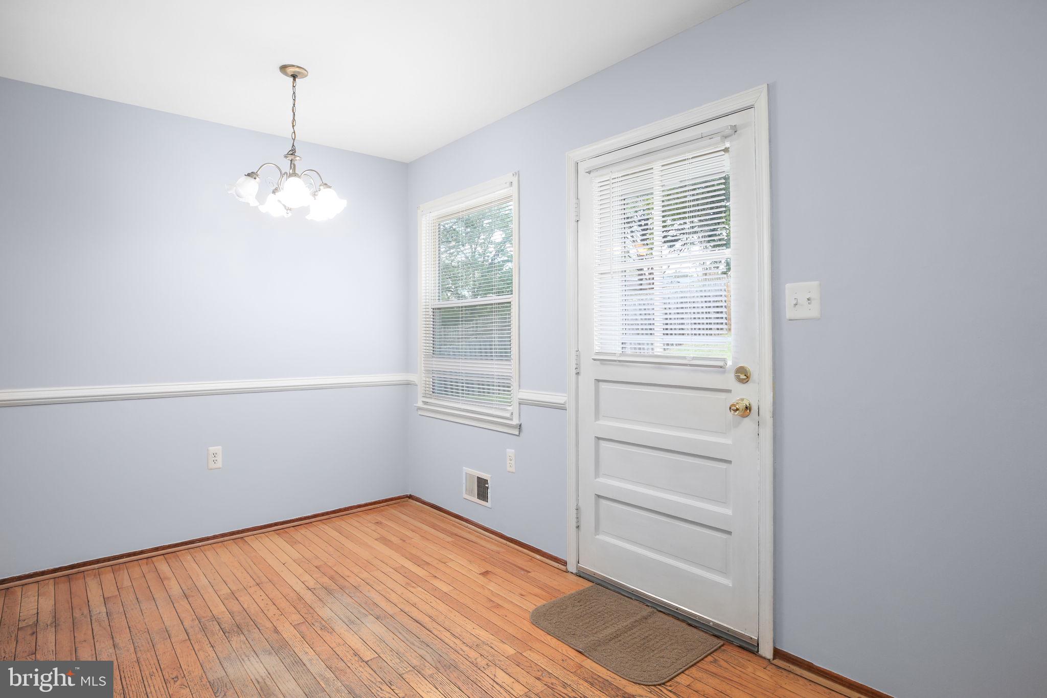 19007 Red Oak Lane Triangle, VA 22172 - Photo 8 of 34 a view of empty room with wooden floor and fan